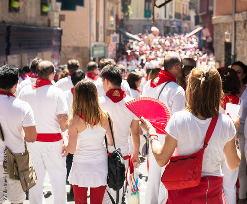 People celebrate San Fermin festival in traditional white abd red clothing with red necktie, 06 July 2016, Pamplona, Navarra, Spain. Crowd