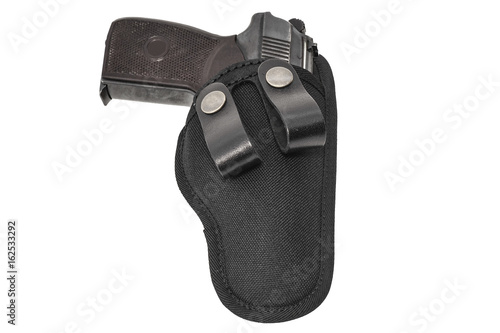 Handgun in the nylon holster. Isolated