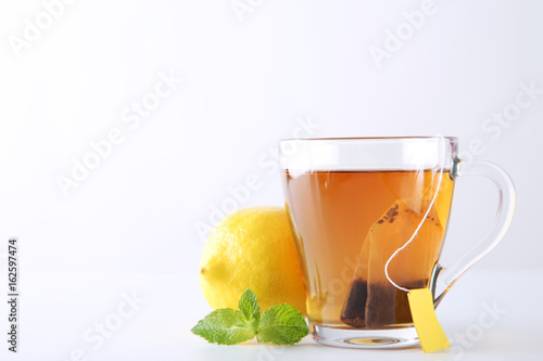 Cup of tea with teabag on a white background