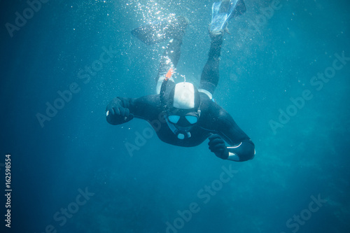 Snorkeling. Free diver underwater