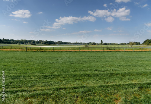 Turf hippodrome in Germany, Magdeburg. Green grass field. View from below