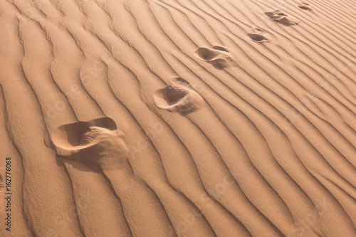 foot trace on the sand desert texture