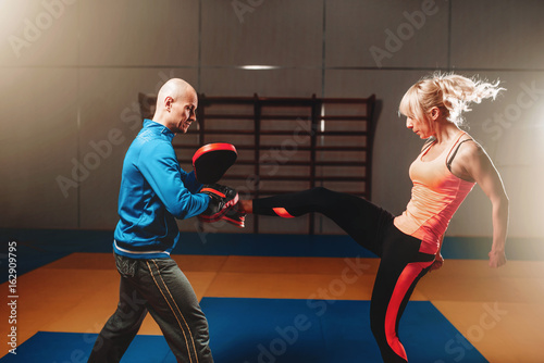 Woman in actoin on self defense workout