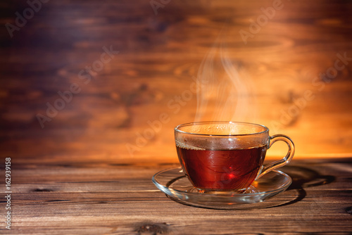 cup of tea on dark wooden background, close up