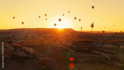 Tourist balloons over Cappadocia during the sunrise