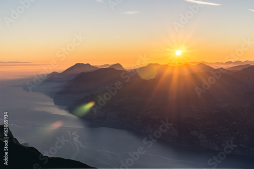 Sunset over the Mountains with Lens Flare