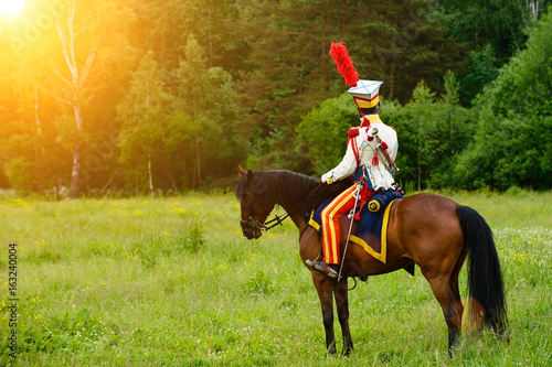 cavalryman on horseback at sunset