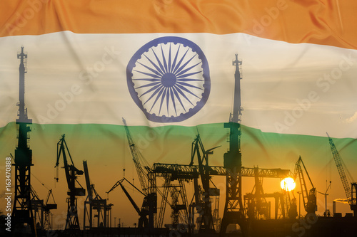 Industrial concept with India flag at sunset