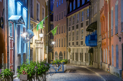 colorful medieval street in Tallinn's old town. Beautiful narrow alley in the summer white night. Attraction In Estonia.