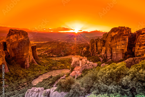 Spectacular colorful sunset over the valley of Meteora, from the best view point, a rock called Psaropetra, Kalambaka, Meteora, Central Greece.