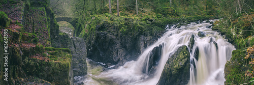 Panoramic view of the Black Linn Falls on the River Braan in the Hermitage woodland. Perthshire, Scotland, UK