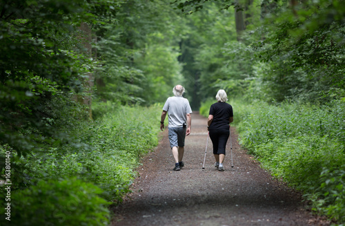 Man and woman walking in forest