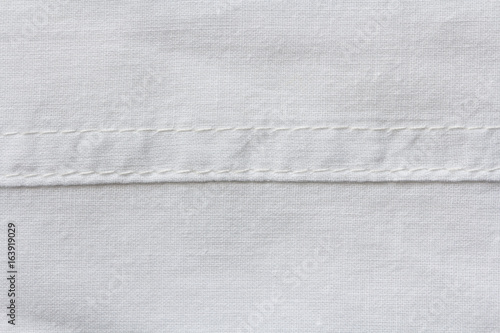 White natural cotton cloth texture with horizontal seam