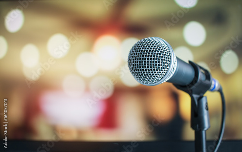 Microphone for speaker on abstract blurred of speech in seminar room or speaking conference for audience at university