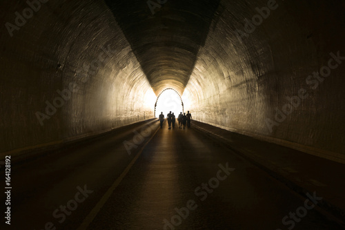 People going to the light at the end of the tunnel