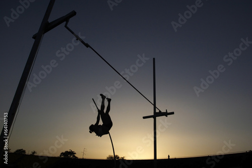 Pole vault during sunset