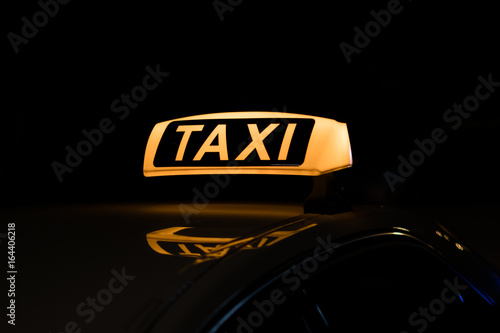 taxi sign illuminated, taxi sign at night