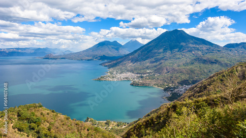 Viewpoint at lake Atitlan with the three volcanos San Pedro, Atitlan and Toliman - you can see the small villages San Pedro and San Juan at the lake in the highlands of Guatemala