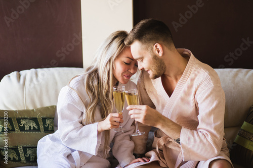 Beautiful couple relaxing in spa center