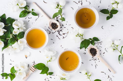 Green tea with a jasmine in white cups