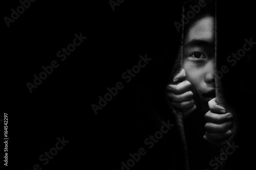 fear girl hiding in closet in white tone