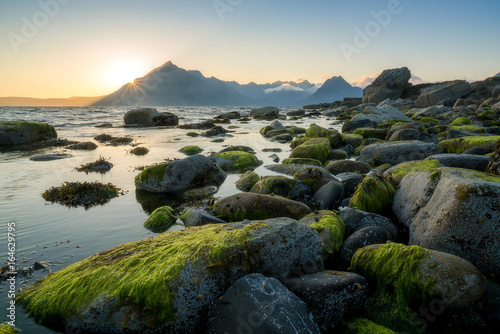 Sunset view of Black Cuillin mountains from rocky Elgol beach