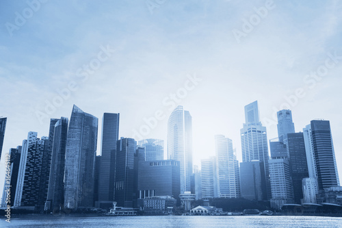 business background, beautiful abstract blue cityscape with skyscrapers and copyspace