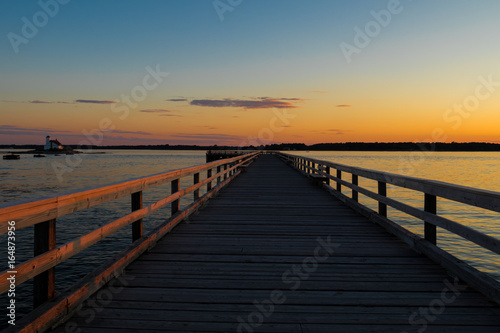 Walkway of a bridge at sunset andamanbangkokbaybeachbridgecolorfuldaydramaticduskharborhorizonislandlagoonlakelandscapemainemaldivesmarinamorningmotorboatnaturenew hampshirenightoceanoverparadisepier