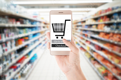 Blurred view of shelves with food stuff in supermarket