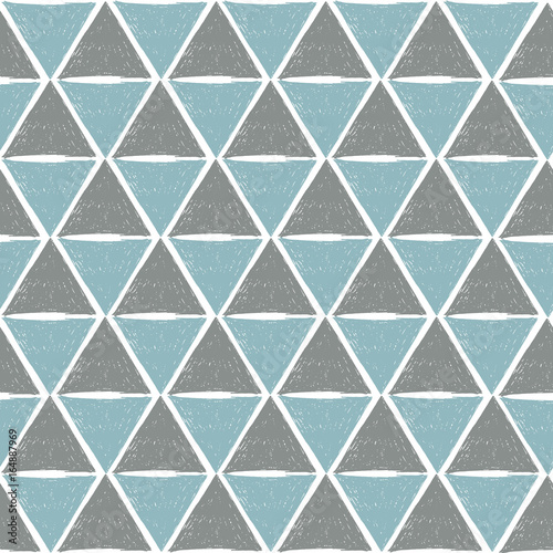Seamless geometric pattern made with grunge handdrawn triangles in blue and grey colors. Abstract background.