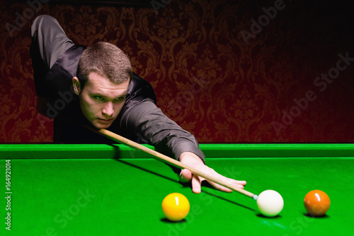 Snooker player during game