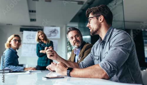 Team of professionals discussing over new business project