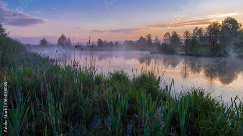 Sunrise at morning lake,fog in mayday