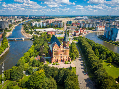 Aerial cityscape of Kant Island in Kaliningrad, Russia at sunny summer day with white clouds in the blue sky