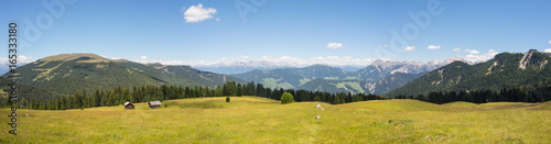 Views of the mountains and the meadows of the Dolomites. The place is around the Pass of Herbs