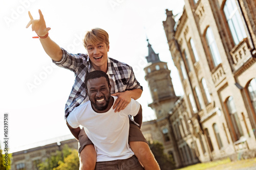 Genuine goofy guy having fun with his friend