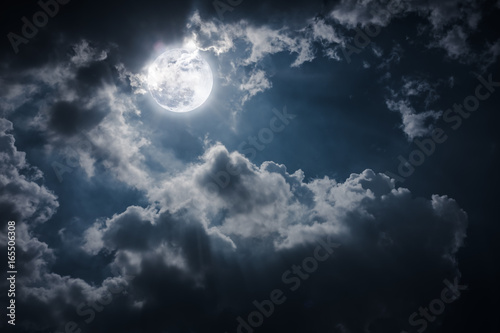 Night landscape of sky with cloudy and bright full moon with shiny.