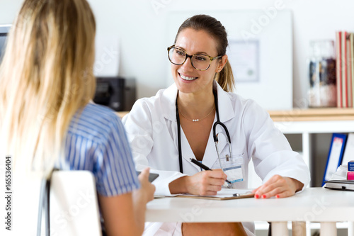 Female doctor explaining diagnosis to her patient.