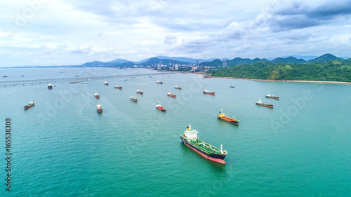 oil tanker, gas tanker in the high sea.Refinery Industry cargo ship. top view,aerial view,Thailand, in import export, LPG,oil refinery, Logistics and transportation with working crane bridge in harbor