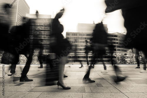 Business and office workers going to work in a fast blur during morning rush hour in Tokyo, Japan