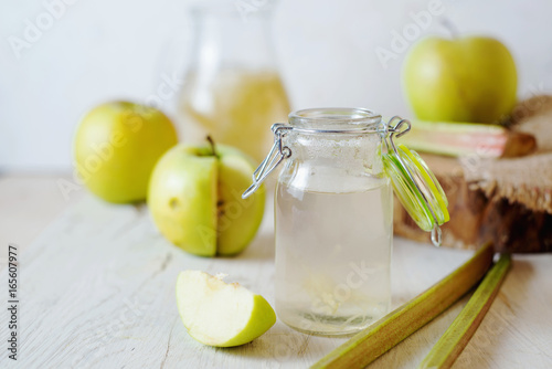 Summer refreshing drink, compote of apple and rhubarb on a light background