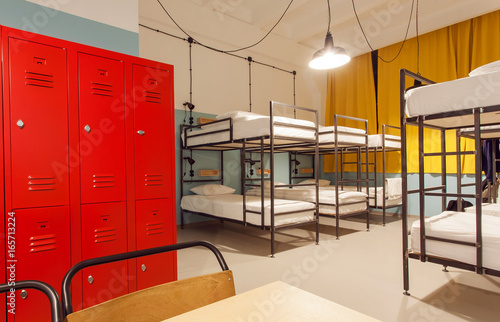 Interior of the students hostel with modern bunk beds and locker for personal things