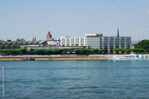 MAINZ, GERMANY - JUL 09th, 2017: Luxury Hilton Hotel next to the Rhine german Rhein. Outside view from the opposite river side. Hilton Hotels Resorts is an international chain of full service hotels