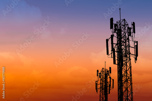 silhouette of communication tower with dusk sky with space for text