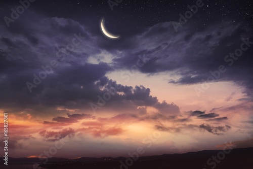  Prayer time . Dramatic nature background . Red sunset and moon . Ramadan background . Arab night . Prayer time 