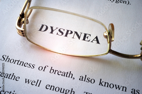 Paper with word dyspnea and glasses.