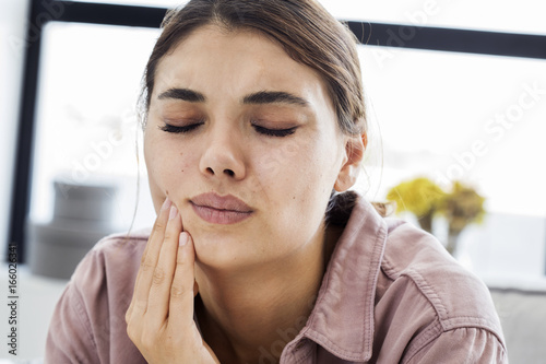 Young woman with toothache