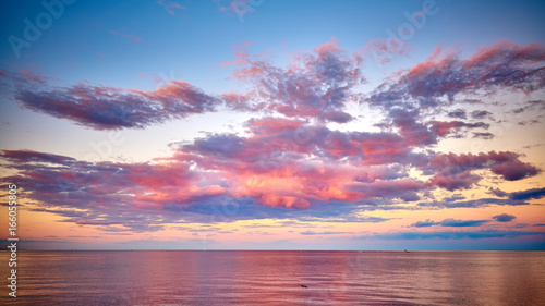 Pink cloudy sunset Lake Superior