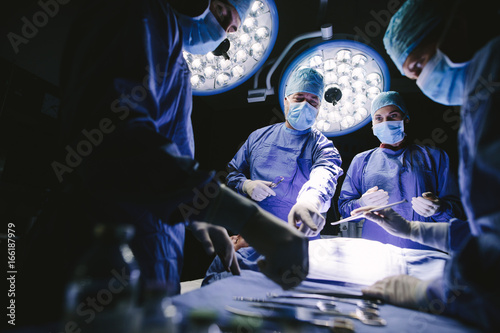 Group of surgeons in operating theater