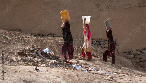 Women carrying water in Kabul, Afghanistan